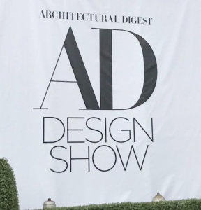 AD Design show sign, white background with black type