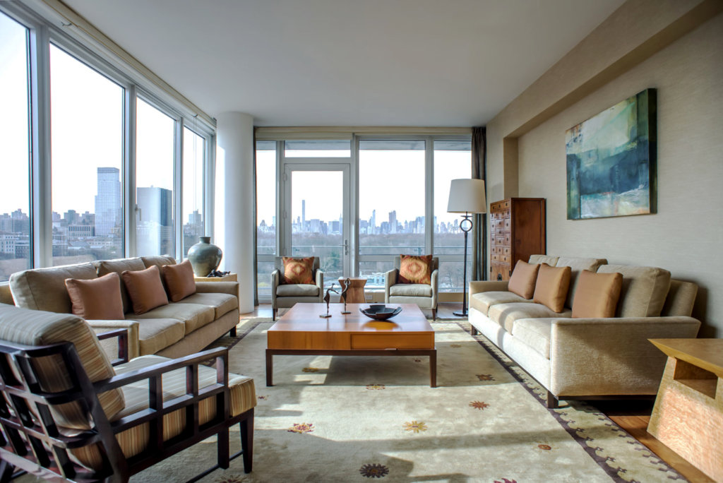 NYC living room scene with floor to ceiling windows