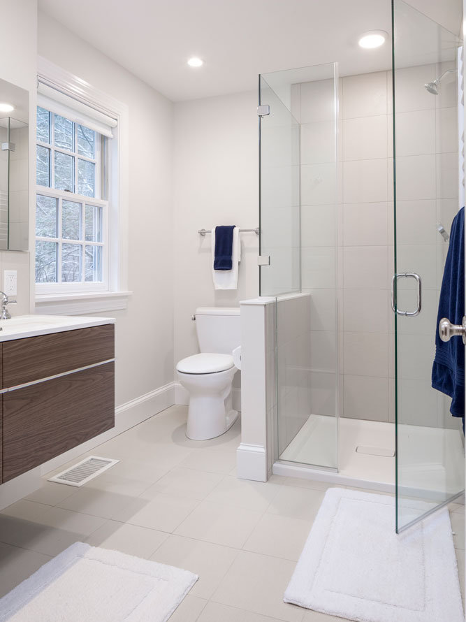 bathroom with view of a toilet and glass shower