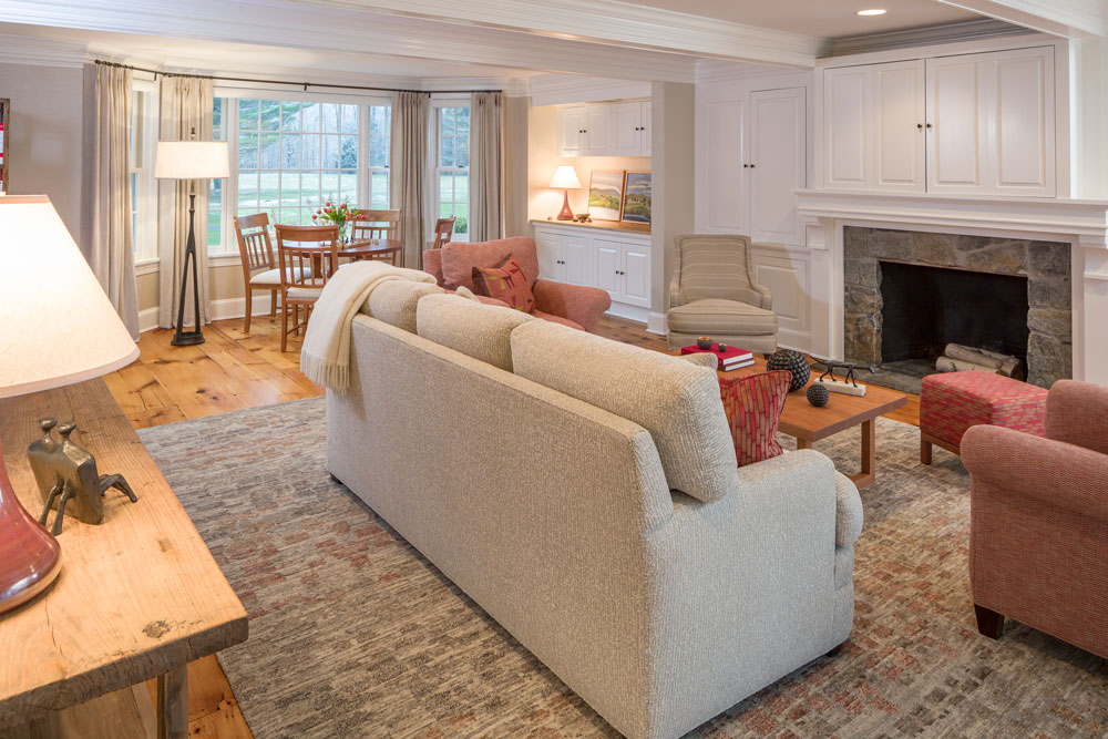 large great room with a fireplace and white couch